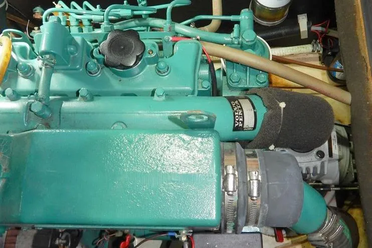 Slide: The Image of Engine compartment of a 1997 Etap 38i sailboat, featuring a Volvo Penta engine. - 50