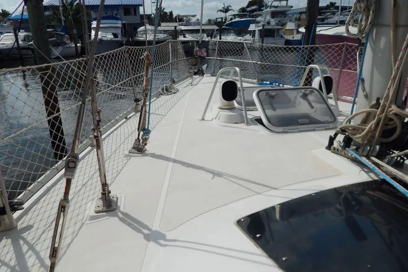 Slide: The Image of Deck view of a 1997 Etap 38i sailboat docked at a marina. - 7