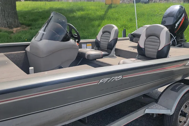 Slide: The Image of 2005 Tracker Pro Team 175 boat with seating and Mercury outboard motor. - 12