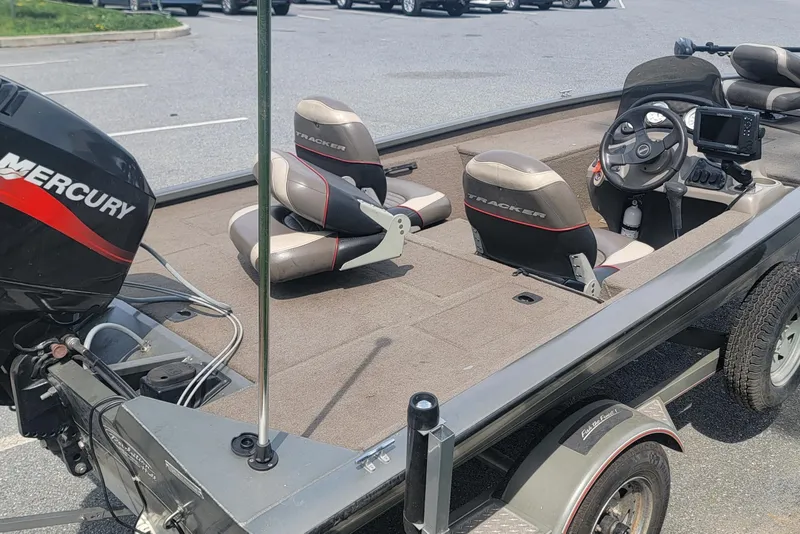 Slide: The Image of 2005 Tracker Pro Team 175 boat with Mercury engine, parked in a lot. - 6
