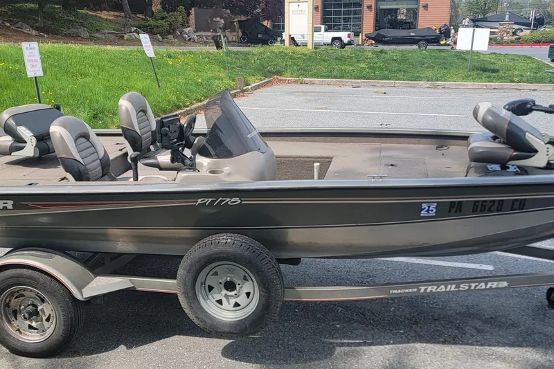 Slide: The Image of 2005 Tracker Pro Team 175 boat on trailer in parking lot. - 7