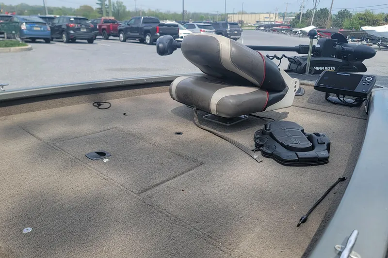 Slide: The Image of 2005 Tracker Pro Team 175 boat interior with seat and fishing equipment. - 9