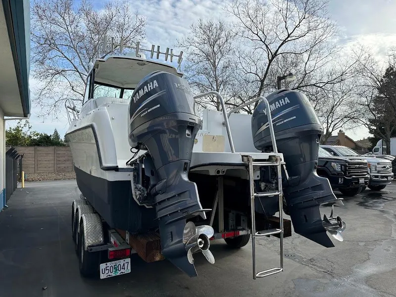 Slide: The Image of 2000 Glacier Bay 2680 Coastal Runner with Yamaha engines on trailer. - 12