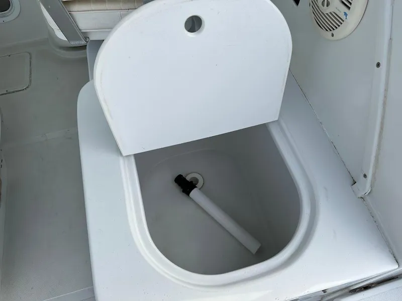 Slide: The Image of Glacier Bay 2680 Coastal Runner 2000 boat, open storage compartment. - 24