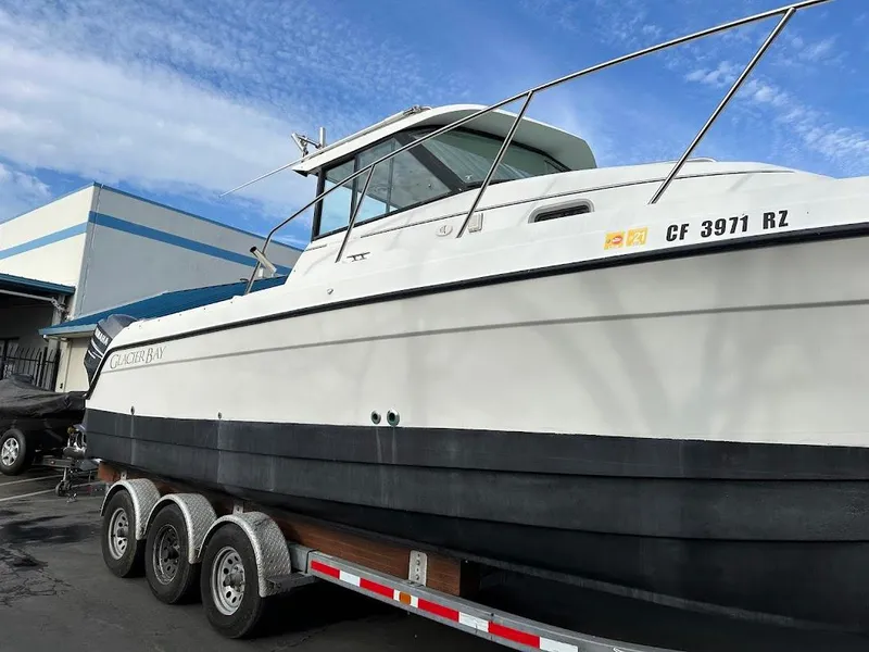 Slide: The Image of Glacier Bay 2680 Coastal Runner 2000 on trailer, side view. - 8