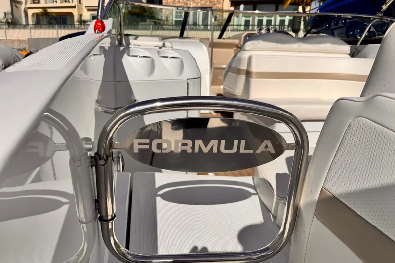 Slide: The Image of 2012 Formula 290 Sun Sport boat interior with branded gate and seating. - 12