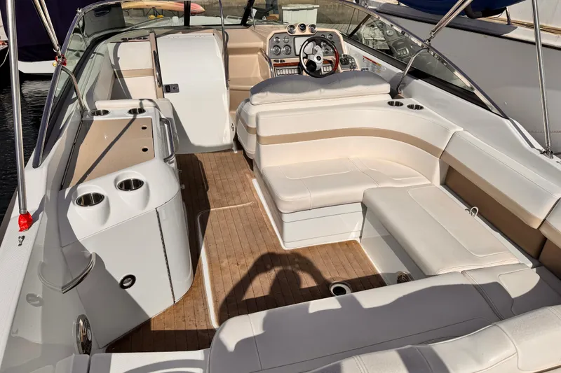 Slide: The Image of 2012 Formula 290 Sun Sport boat interior with luxurious seating and modern dashboard. - 13