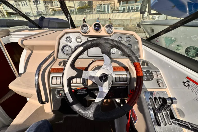 Slide: The Image of Steering wheel and dashboard of 2012 Formula 290 Sun Sport boat. - 19