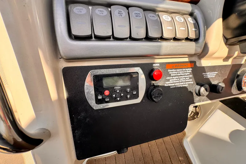 Slide: The Image of Control panel of a 2012 Formula 290 Sun Sport boat with switches and warning label. - 20