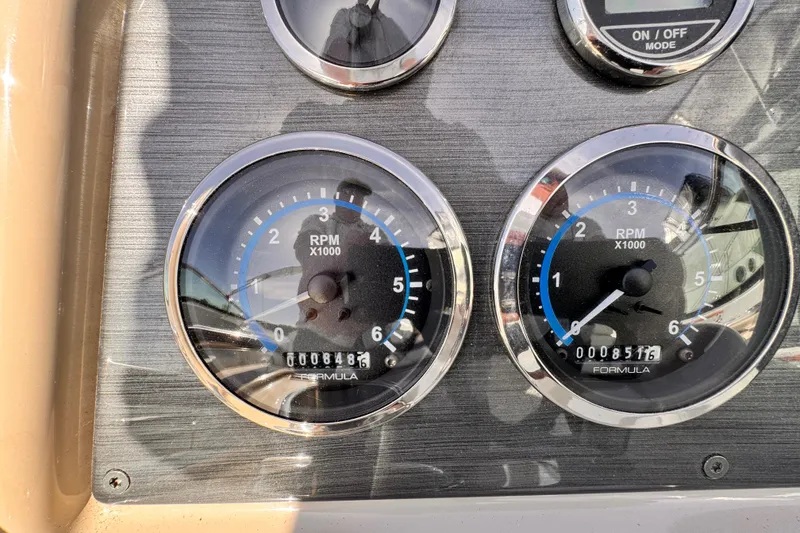 Slide: The Image of Dashboard gauges of a 2012 Formula 290 Sun Sport boat showing RPM readings. - 23