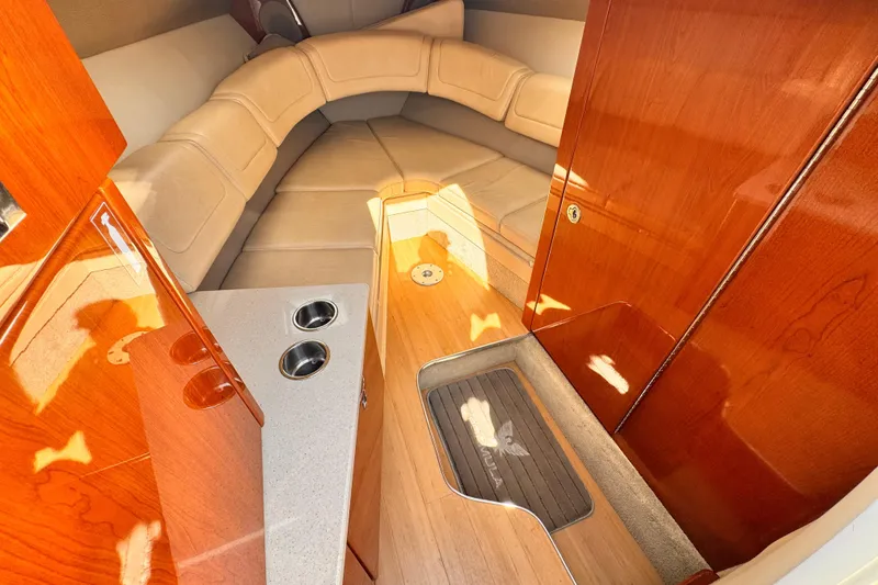 Slide: The Image of Luxurious interior of 2012 Formula 290 Sun Sport boat with plush seating and wood finishes. - 25