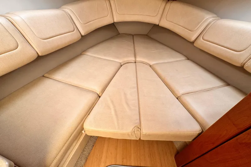 Slide: The Image of 2012 Formula 290 Sun Sport cabin interior with beige cushioned seating. - 27