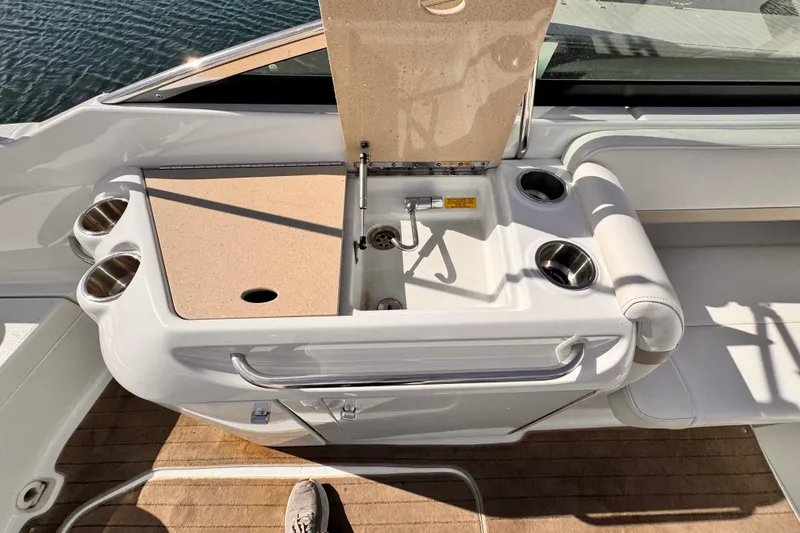 Slide: The Image of 2012 Formula 290 Sun Sport boat interior with sink and cup holders. - 33