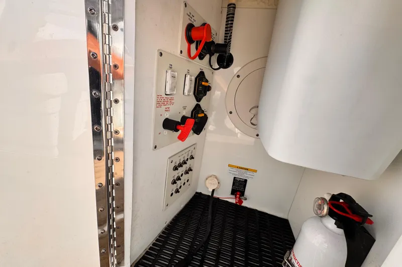 Slide: The Image of 2012 Formula 290 Sun Sport boat interior control panel with safety equipment. - 34