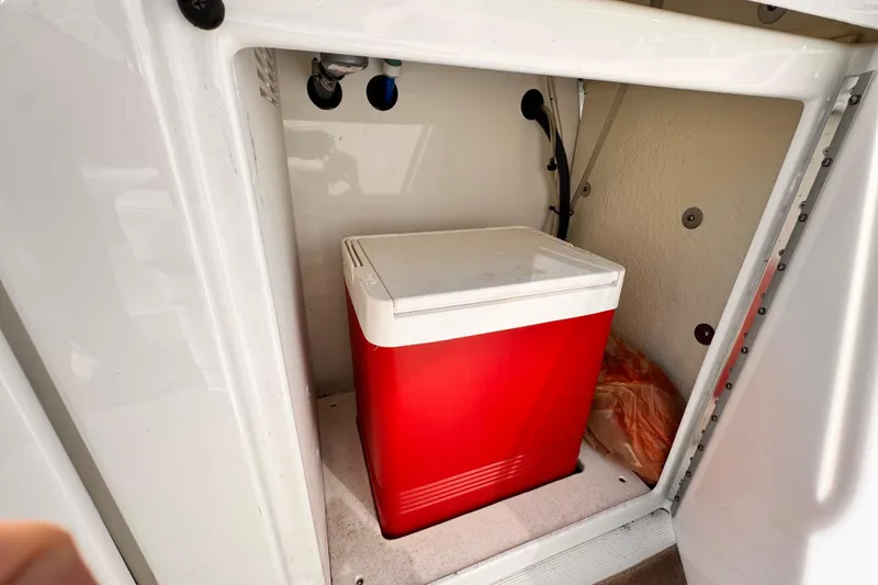Slide: The Image of Red cooler inside 2012 Formula 290 Sun Sport storage compartment. - 35