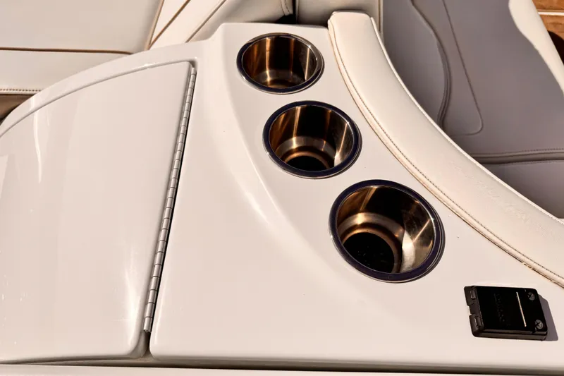 Slide: The Image of 2012 Formula 290 Sun Sport boat interior with cup holders and sleek design. - 37