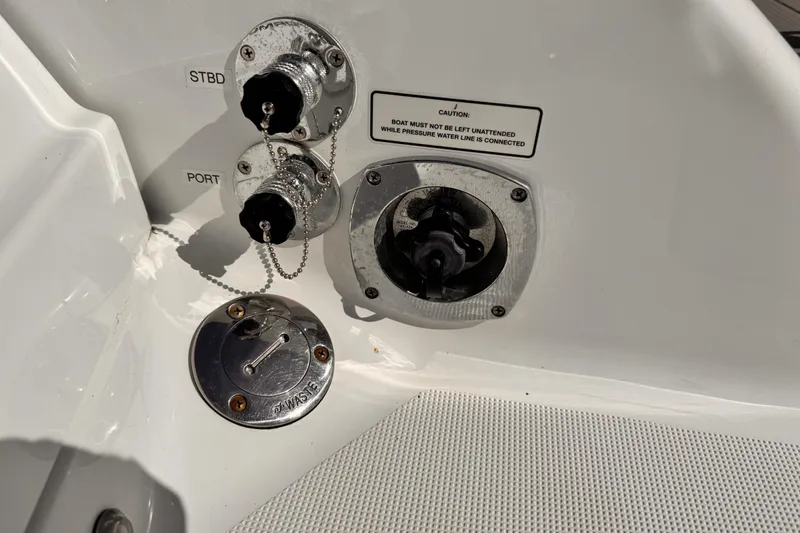 Slide: The Image of 2012 Formula 290 Sun Sport boat fittings and caution label on deck. - 39