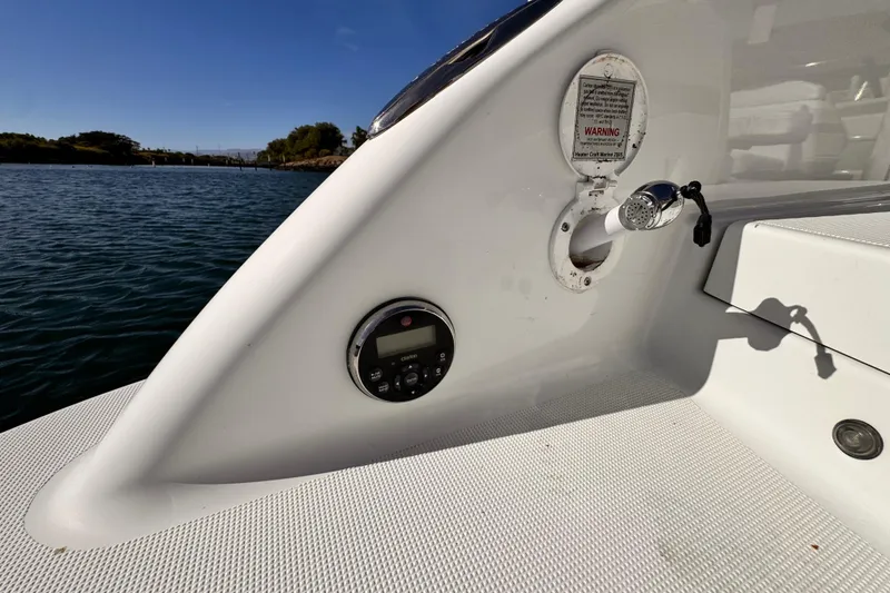 Slide: The Image of 2012 Formula 290 Sun Sport boat deck with control panel and water outlet. - 40