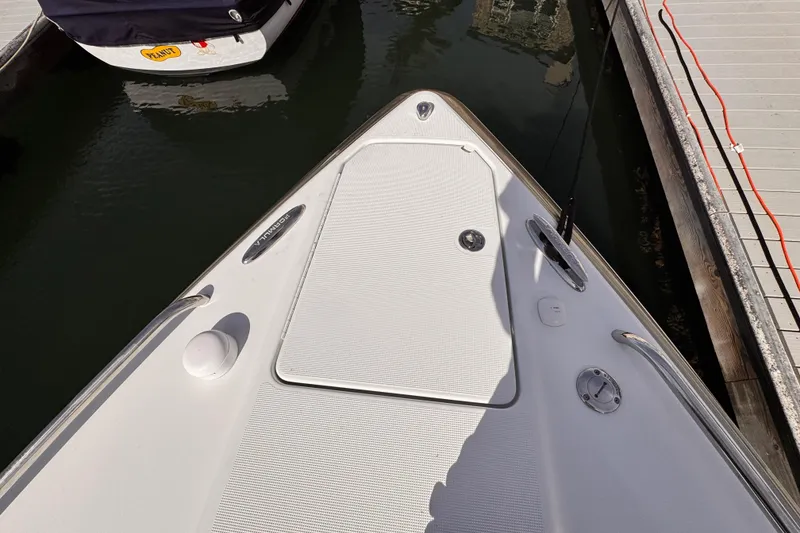 Slide: The Image of Bow of 2012 Formula 290 Sun Sport boat docked at marina. - 43