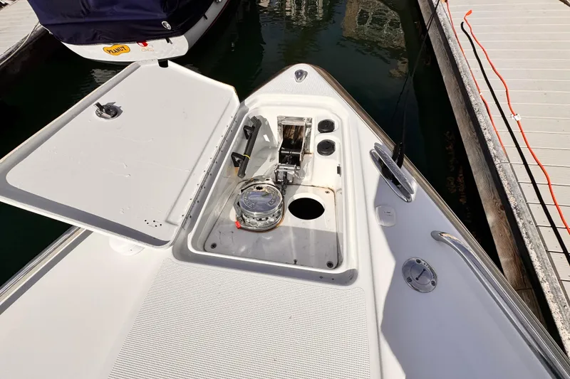 Slide: The Image of 2012 Formula 290 Sun Sport boat anchor compartment at marina dock. - 44