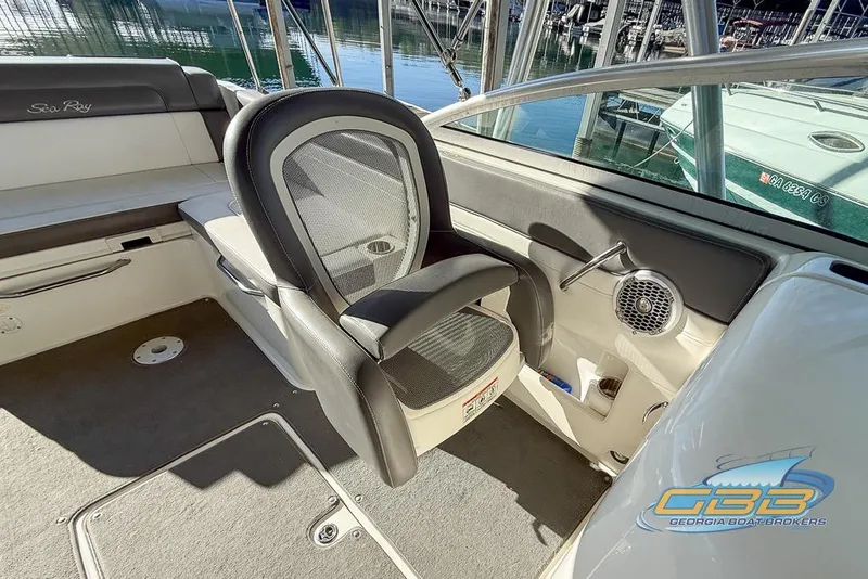 Slide: The Image of Interior of a 2011 Sea Ray 260 Sundeck boat, featuring seating and speaker. - 12