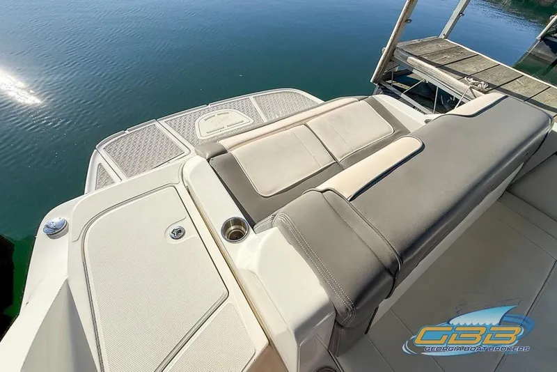 Slide: The Image of 2011 Sea Ray 260 Sundeck boat with spacious seating and swim platform. - 17