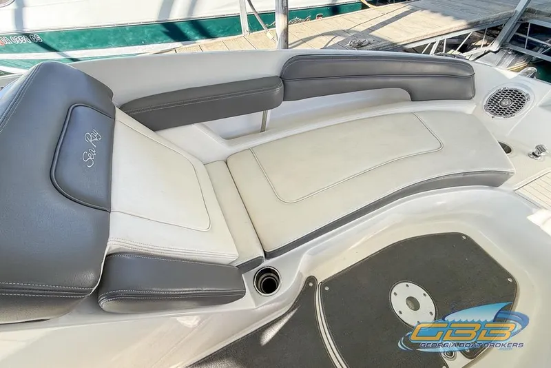 Slide: The Image of 2011 Sea Ray 260 Sundeck interior with cushioned seating and speaker detail. - 3