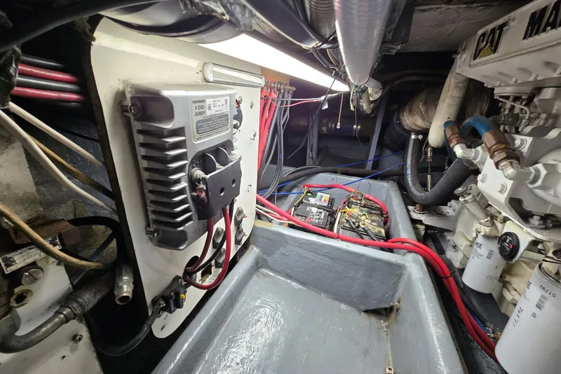 Slide: The Image of Engine room of a 1995 MDI Down East boat, featuring electrical components and wiring. - 11