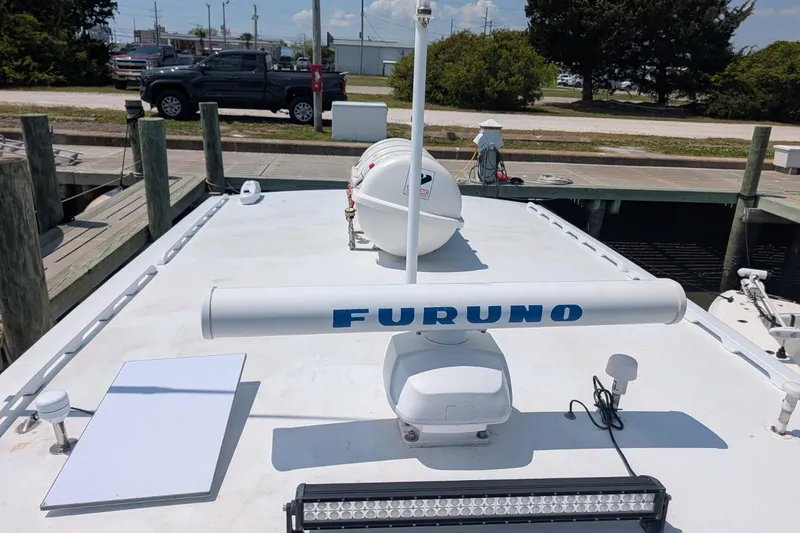 Slide: The Image of 1995 MDI Down East boat with Furuno radar, docked at a marina. - 9
