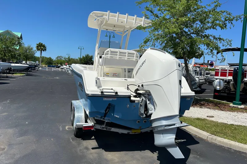 Slide: The Image of 2026 Mako 226 Center Console boat with Mercury outboard motor on a trailer. - 1