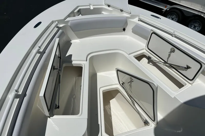 Slide: The Image of 2026 Mako 226 Center Console boat with open storage compartments. - 10