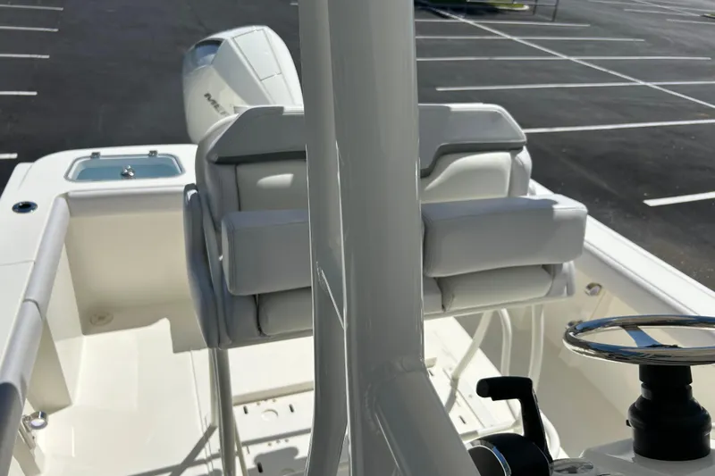 Slide: The Image of 2026 Mako 226 Center Console boat interior with steering wheel and seating. - 7
