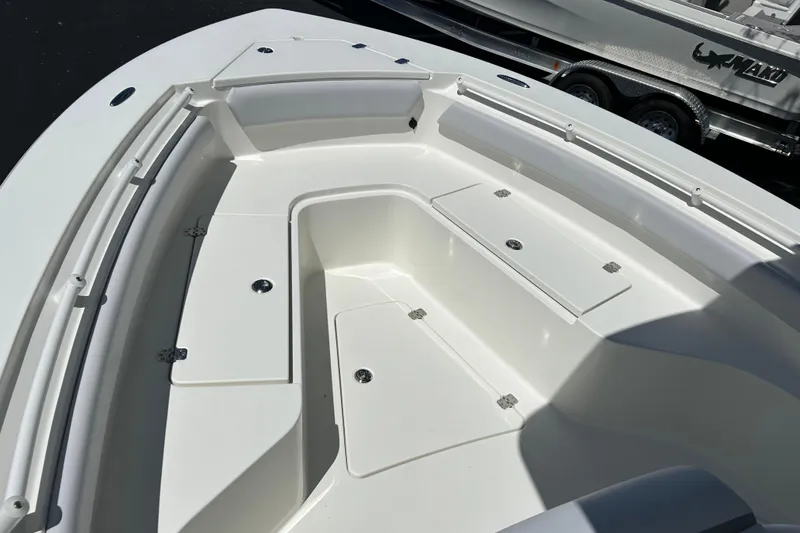Slide: The Image of 2026 Mako 226 Center Console boat interior with storage compartments and sleek design. - 9