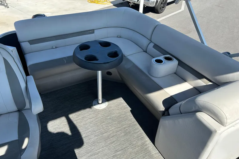 Slide: The Image of 2021 Godfrey Sweetwater 1880 CX boat interior with gray seating and cup holders. - 11