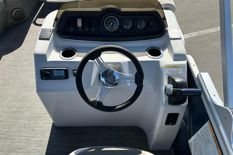 Slide: The Image of Steering console of 2021 Godfrey Sweetwater 1880 CX pontoon boat with gauges and controls. - 12