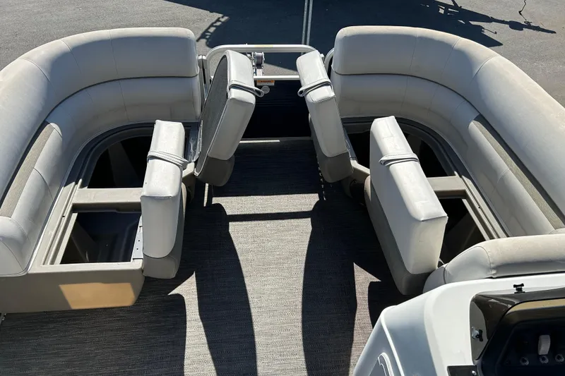 Slide: The Image of 2021 Godfrey Sweetwater 1880 CX pontoon boat interior with spacious seating and storage compartments. - 14