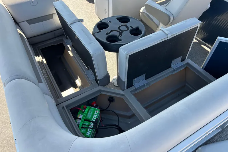 Slide: The Image of Open storage compartments on a 2021 Godfrey Sweetwater 1880 CX pontoon boat. - 15