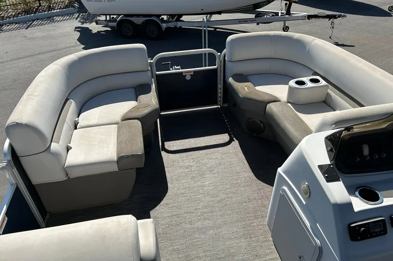 Slide: The Image of Interior of a 2021 Godfrey Sweetwater 1880 CX pontoon boat with plush seating. - 8