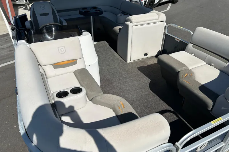 Slide: The Image of 2021 Godfrey Sweetwater 1880 CX pontoon boat interior with plush seating and cup holders. - 9