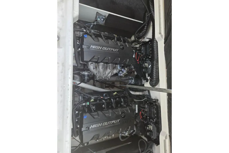 Slide: The Image of 2023 Yamaha Boats 222S high output engines in engine compartment. - 15