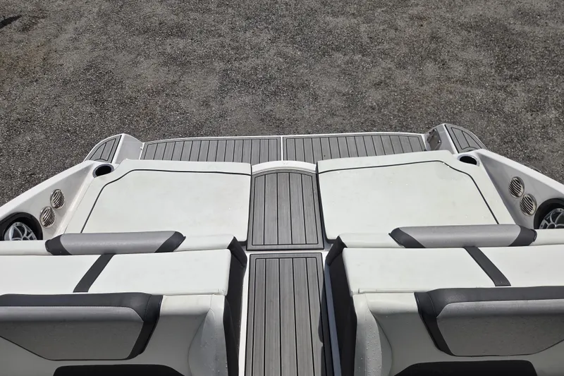 Slide: The Image of 2023 Yamaha Boats 222S swim platform with cushioned seating and sleek design. - 16