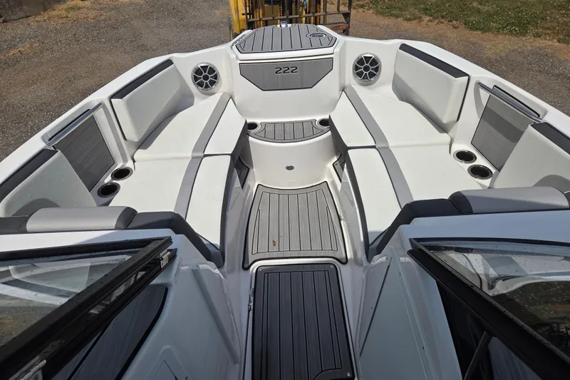 Slide: The Image of 2023 Yamaha Boats 222S interior with spacious seating and modern design. - 18