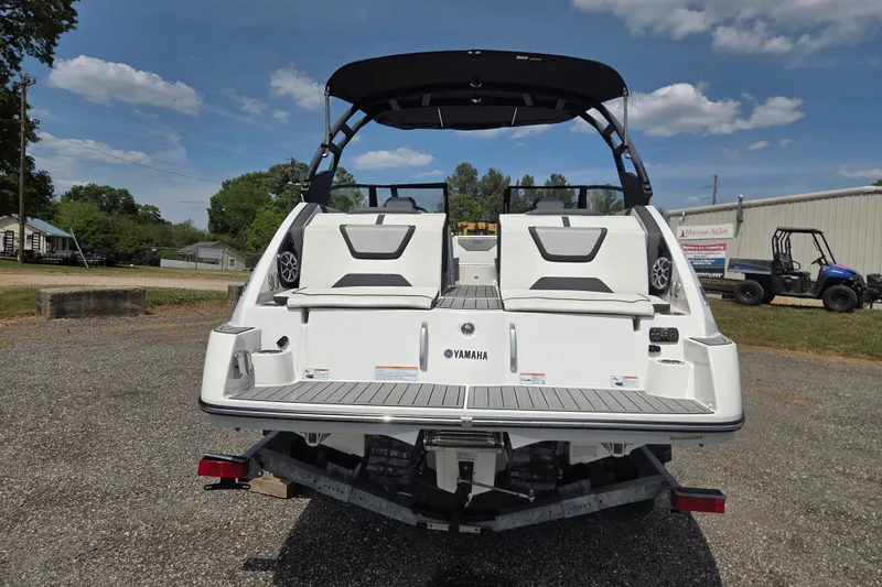 Slide: The Image of 2023 Yamaha Boats 222S, rear view, showcasing sleek design and spacious seating. - 5