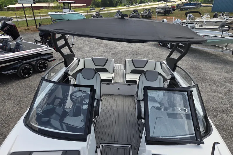 Slide: The Image of 2023 Yamaha Boats 222S with sleek design, spacious seating, and modern canopy. - 8