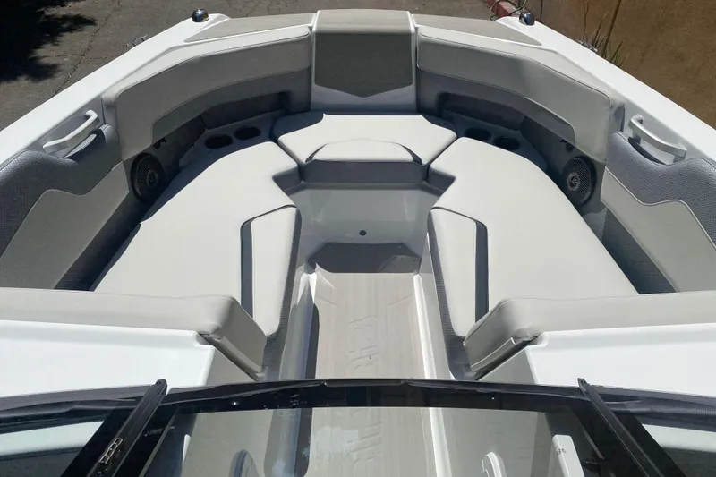 Slide: The Image of 2025 Scarab 235 SE boat interior with sleek seating and modern design. - 11
