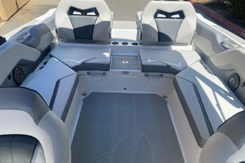 Slide: The Image of 2025 Scarab 235 SE boat interior with modern seating and cup holders. - 15