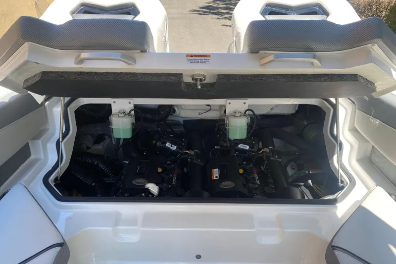 Slide: The Image of Engine compartment of 2025 Scarab 235 SE boat, showcasing internal components and design. - 18