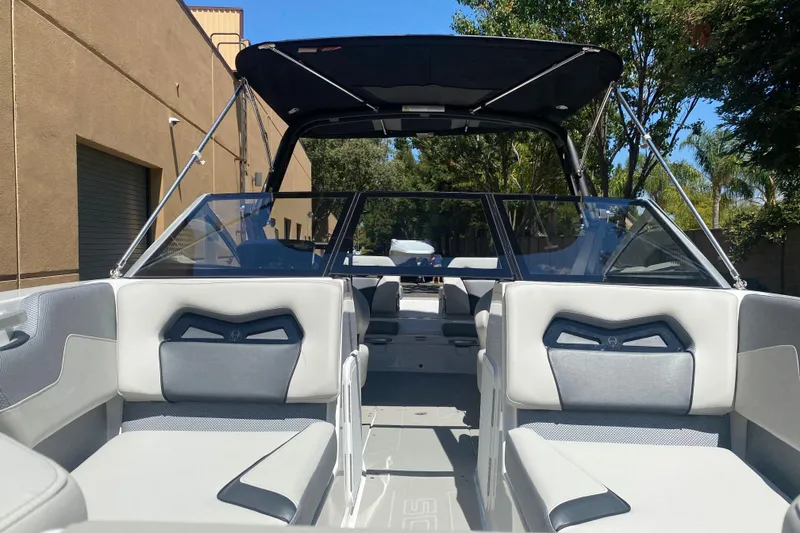 Slide: The Image of 2025 Scarab 235 SE boat interior with sleek seating and modern design. - 25