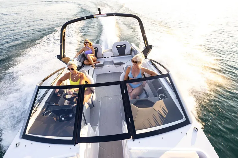 Slide: The Image of Manufacturer Provided Image: Scarab 235 SE 2025 boat with three people on the water. - 30