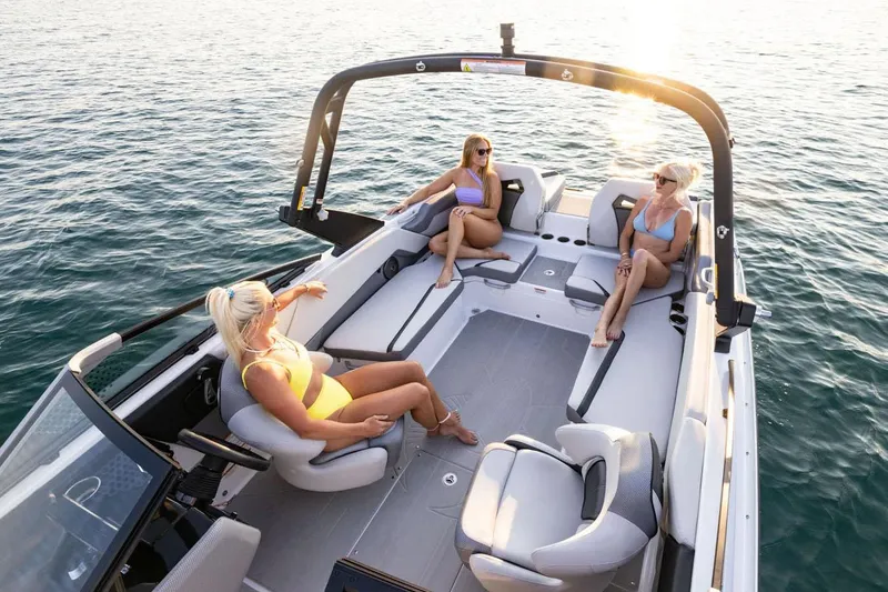 Slide: The Image of Manufacturer Provided Image: Three women relaxing on a 2025 Scarab 235 SE boat. - 31